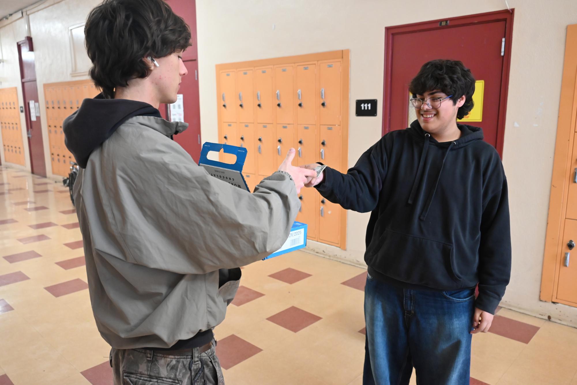 Students are selling "World's Finest Chocolate" to raise funds for school activities. The initiative encourages business skills and community involvement.