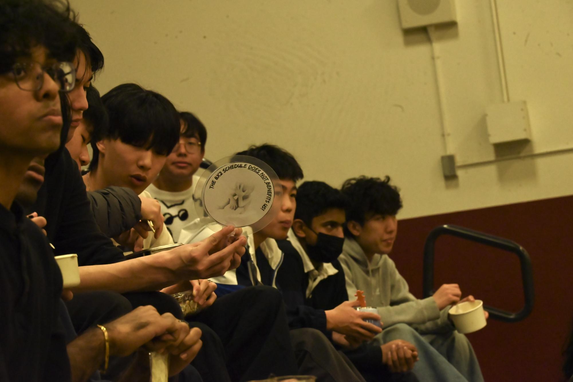 Students in the crowd are seen paying close attention to student Dwanye Famenias Rebuttal. 