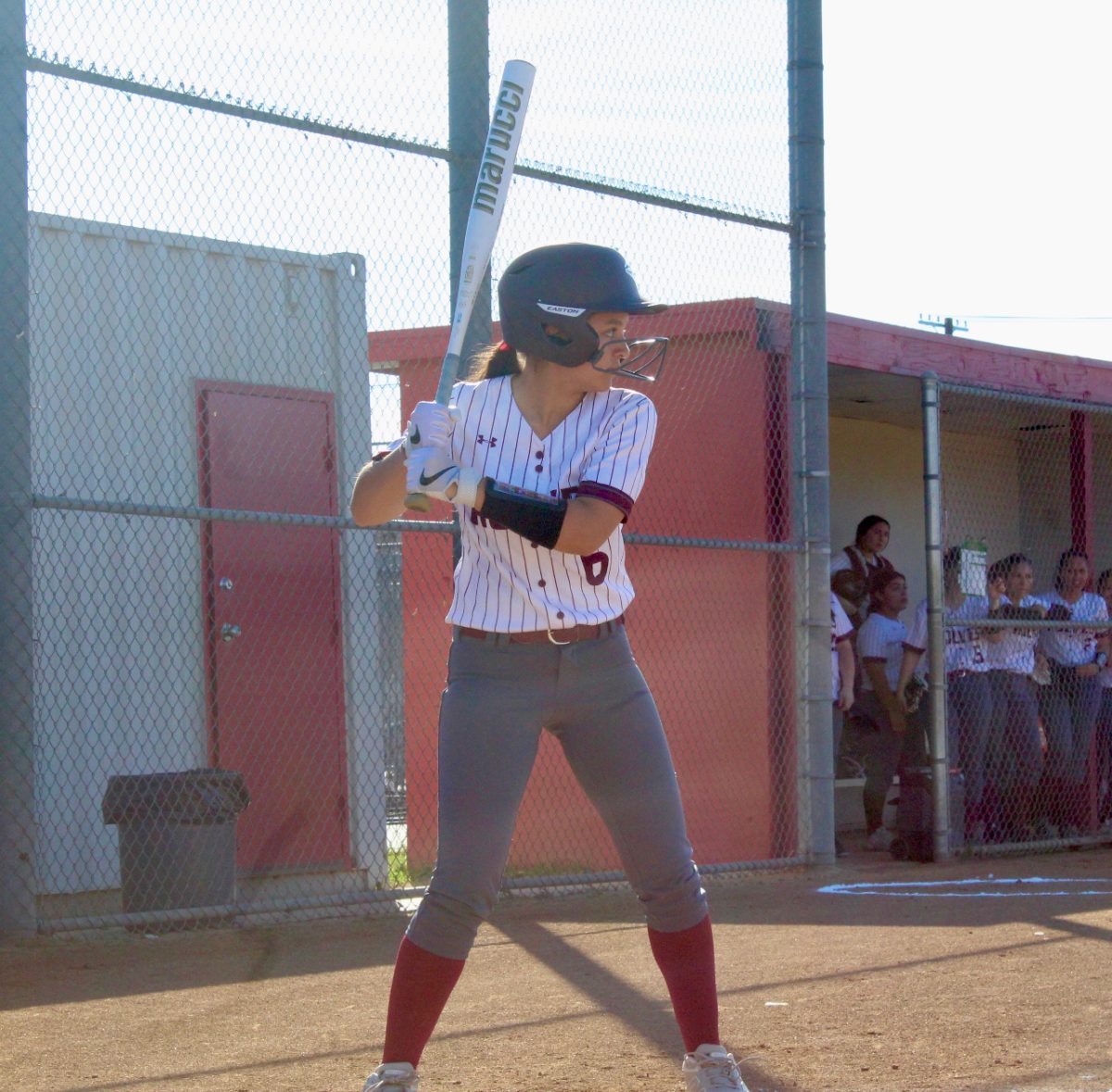 With all eyes on her, freshman Isabella Espinoza steps up to make her first swing.