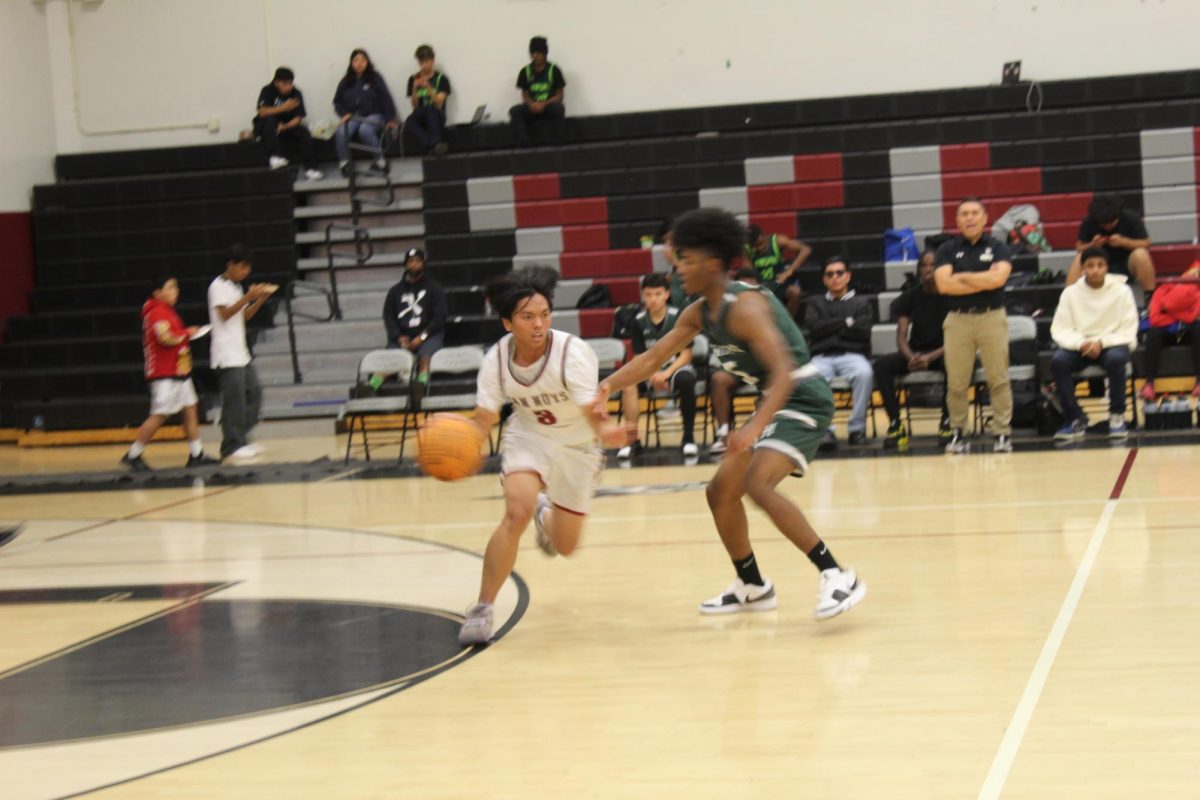 Player 8 pushes through his defender to create a point opportunity for his team. 