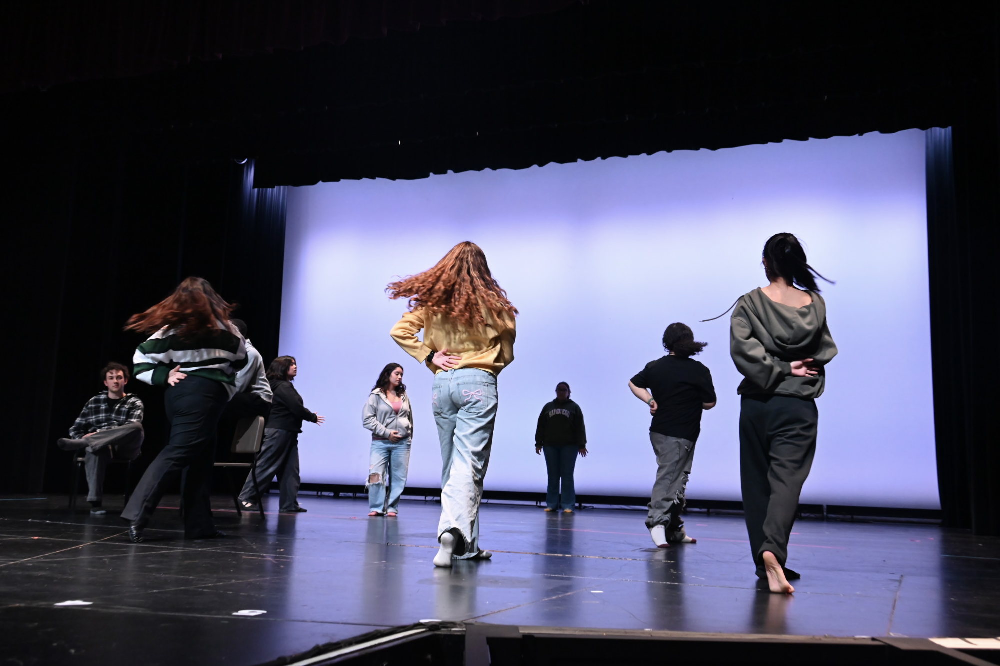 The "Mamma Mia!" cast at Van Nuys High School embraces the challenge of mastering music and dance routines, showcasing dedication and teamwork as they prepare for the March opening.