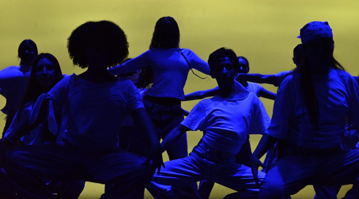 With light manipulation like no other by senior Kayla Balikyan-Davis, the dance company is highlighted in blue to showcase their dance moves.