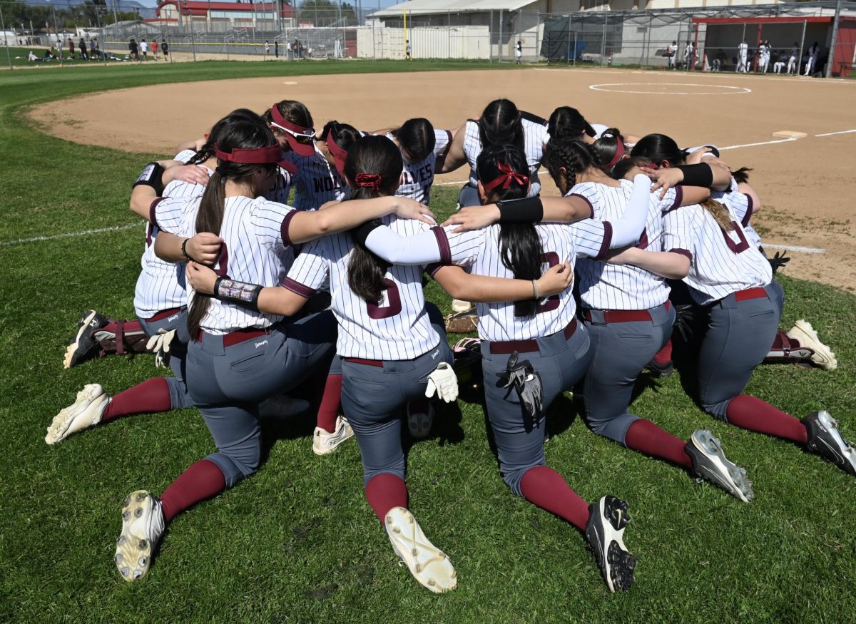 Right before their game against the Panorama Vipers, the wolves gather in a circle for their prayers.