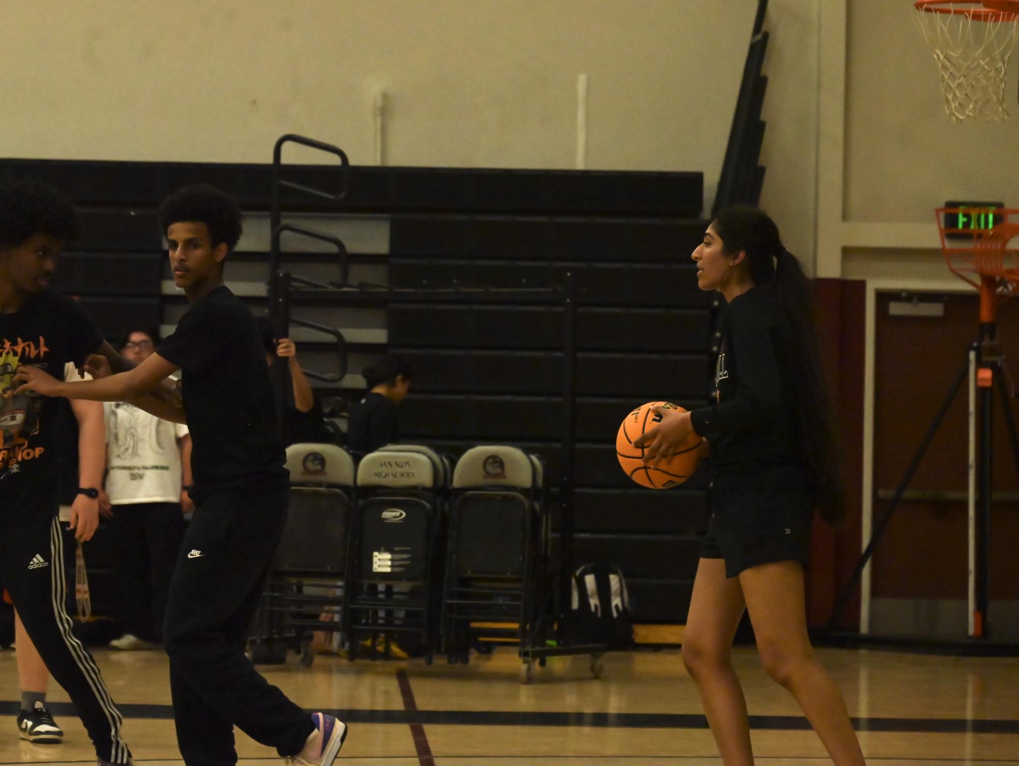 Seniors and teachers faced off in a spirited "March Madness" basketball game, showcasing school spirit and friendly competition. The event brought together students and faculty for an exciting match.