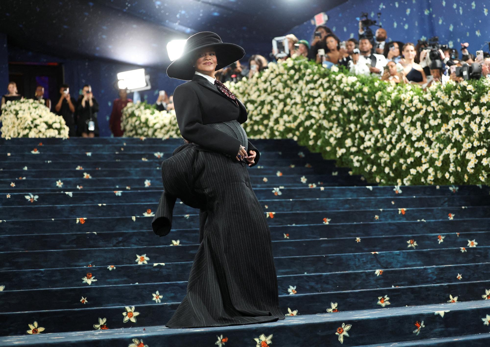 Rihanna poses during the Met Gala, an annual fundraising gala held for the benefit of the Metropolitan Museum of Art's Costume Institute with this year's theme 'Superfine: Tailoring Black Style,' in New York City, New York, U.S., May 5, 2025. REUTERS/Mario Anzuoni