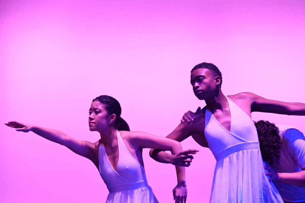 Senior Ceanna Feliciano and Xavier Martin-Porter stick together as they gracefully dance on the auditorium.