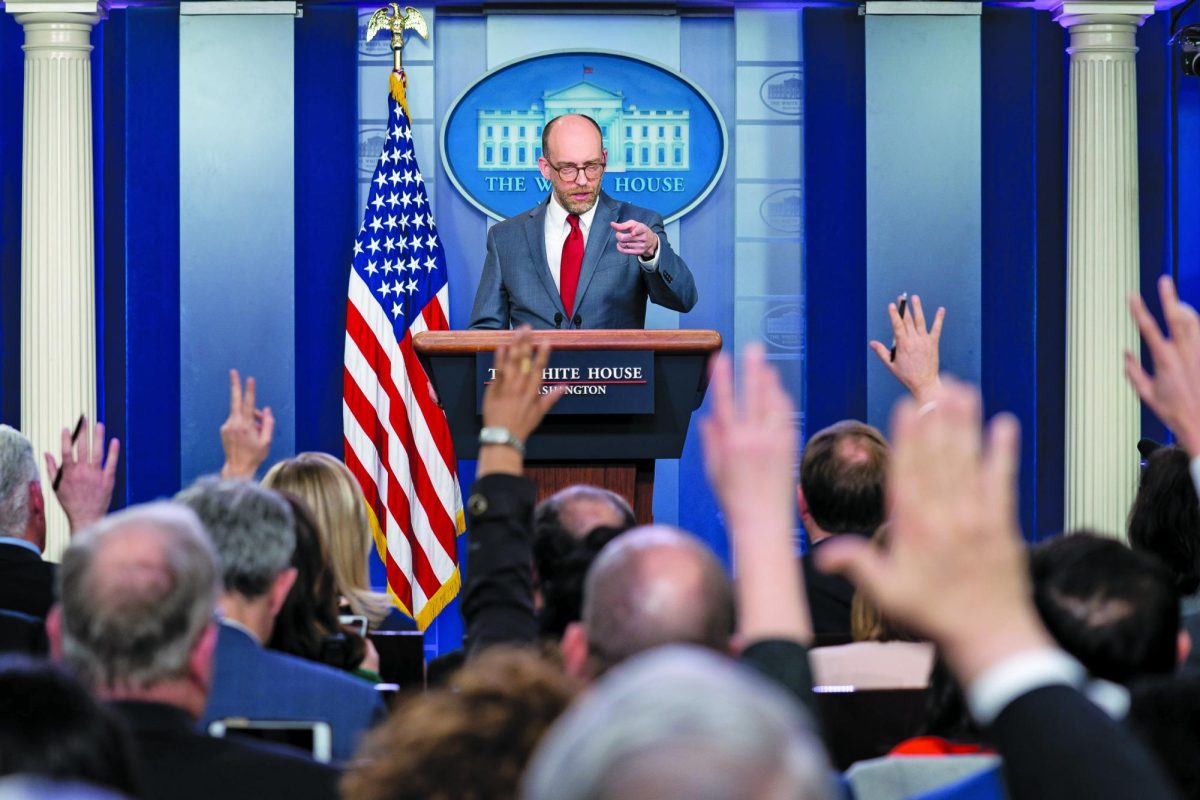 MASTERMIND Reporters raise their hands to ask a question of Acting Director of the Office of Management and Budget, Russell Vought, the master architect of Project 2025, during a press briefing. (Courtesy of the White House by Tia Dufour)