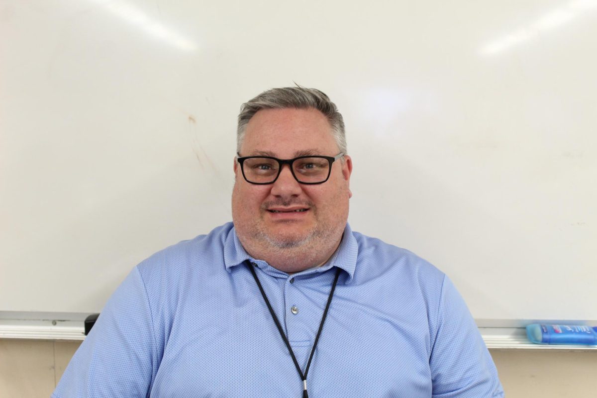 Mr. Weber smiles in his classroom, where he teaches history and leads the Associated Student Body. THE MIRROR | KIMBERLY SALAZAR