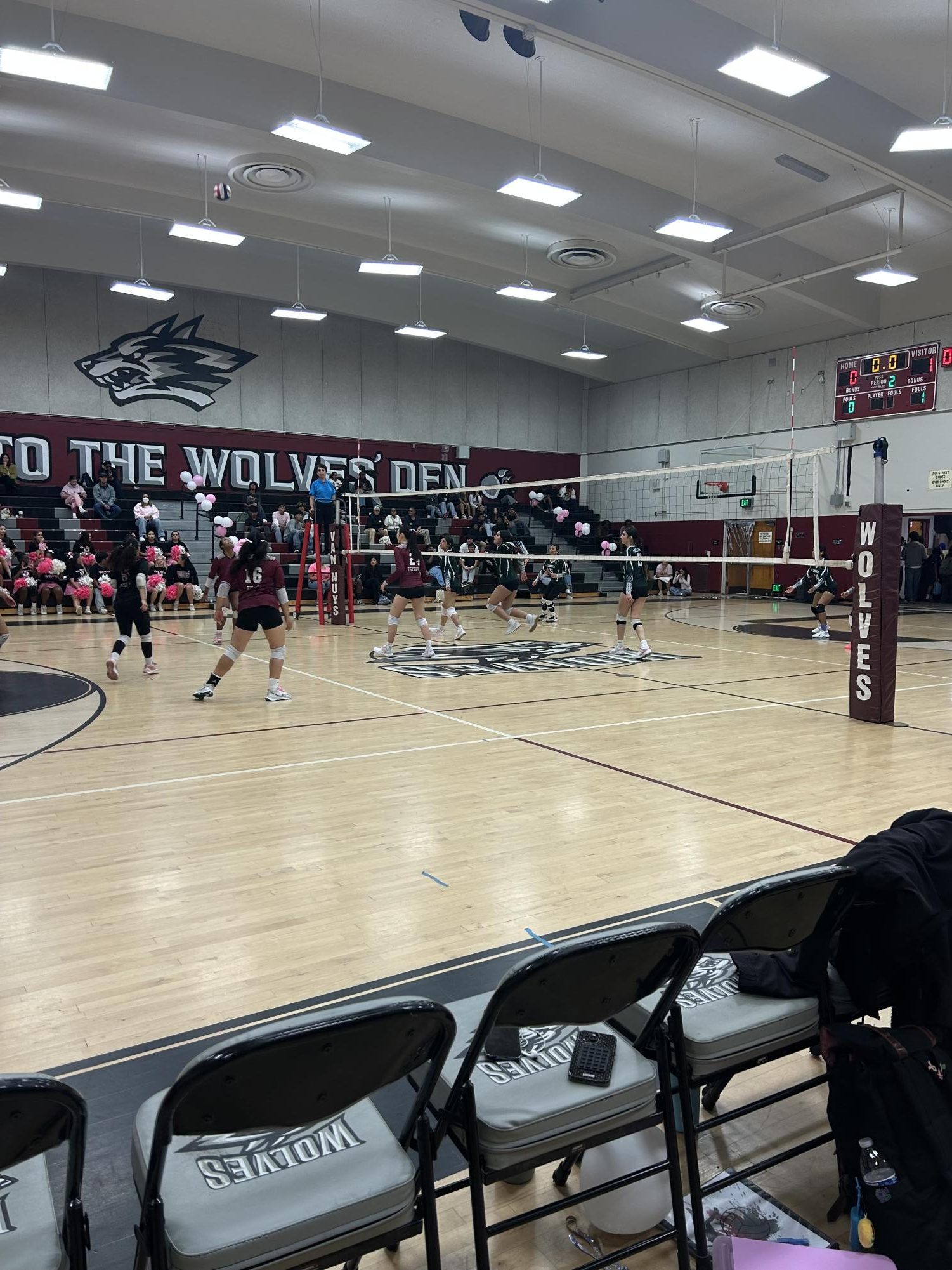 Pink Party  The girl's volleyball team prepares to act on a pass during their senior night game