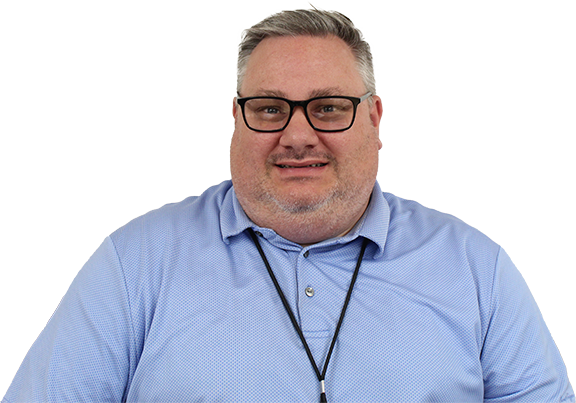 Mr. Weber smiles in his classroom, where he teaches history and leads the Associated Student Body. THE MIRROR | KIMBERLY SALAZAR