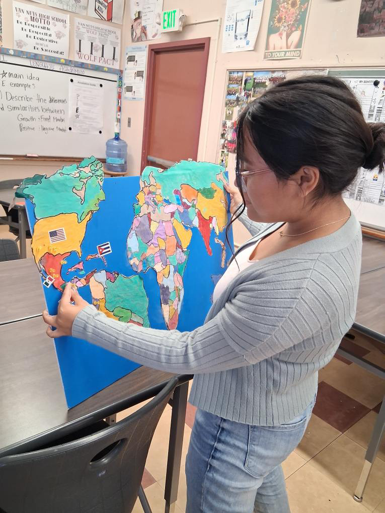  Cultural Crafts  Senior Samantha Silva takes a look at a map made by the club