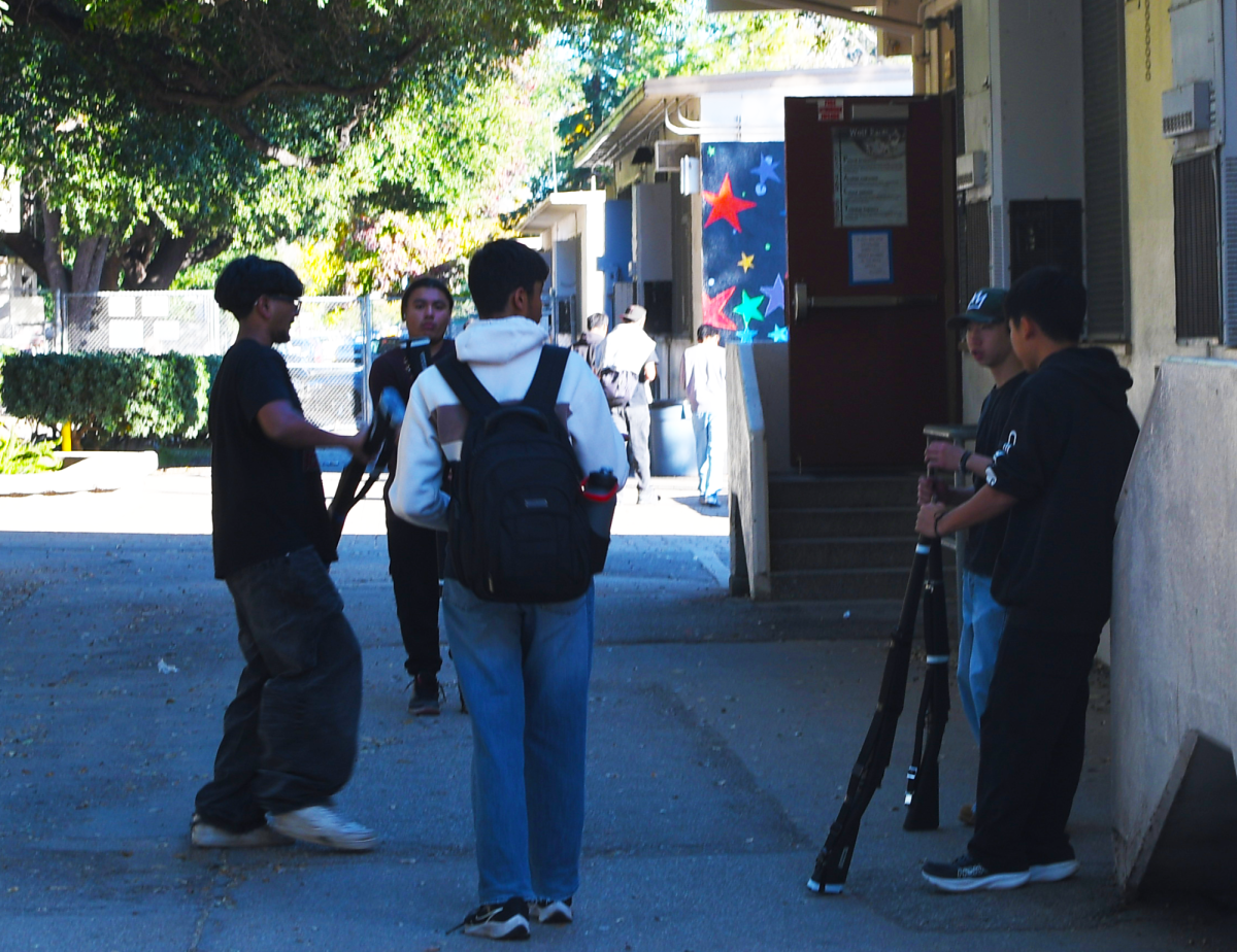 JROTC students are shown practicing and talking to each other on campus after school


