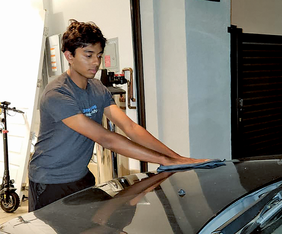High school sophomore Aarush Sojitra balances his power washing business, Aqua Edge, with AP classes and other activities. Sojitra is pictured between weekend jobs in Porter Ranch, Calif. More information is available in the article. THE MIRROR | MELOS SERA