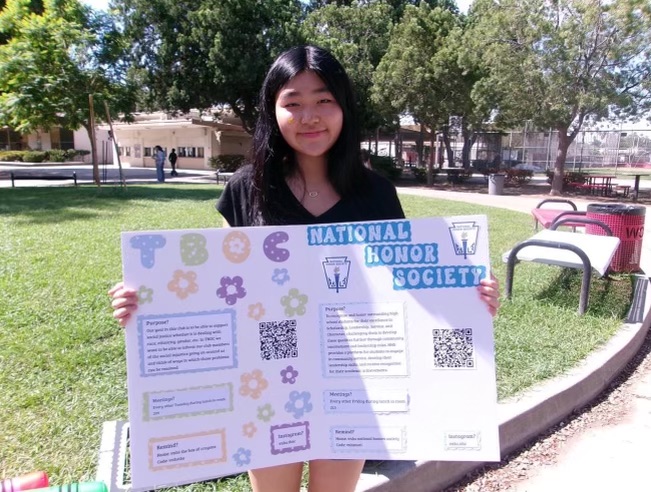 President of TBOC, Amanda Hung, holds a poster used to promote her club Courtesy of | The Box of Crayons