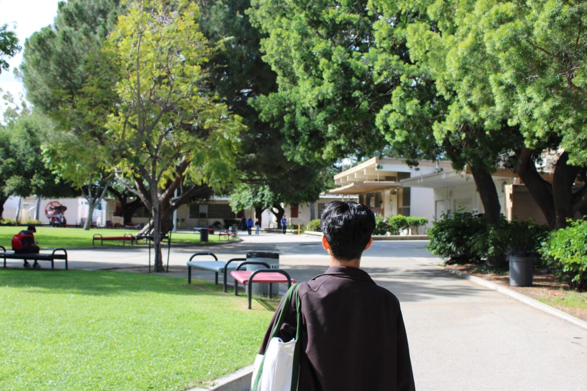 Senior Armando Pacheco starts his morning off in the quad, walking to his 1st period. 